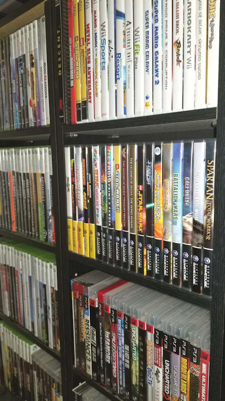 Disk Based Video Games Organized on Bookshelf