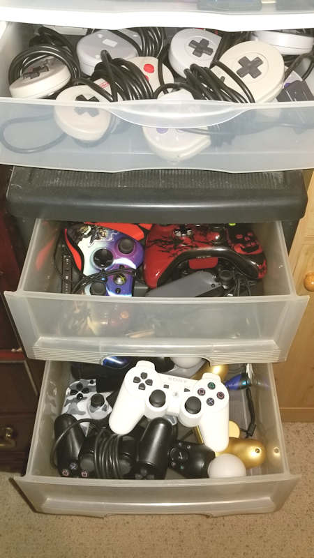 Gaming controllers in plastic drawer units