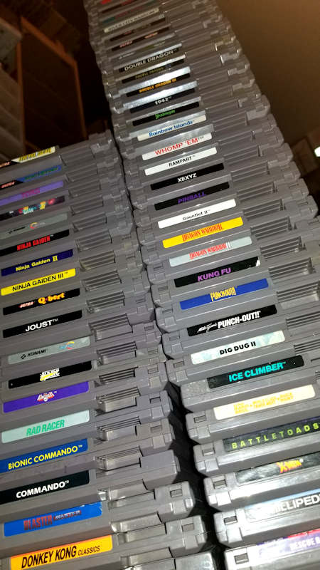 Two big stacks of Original Nintendo NES cartridges